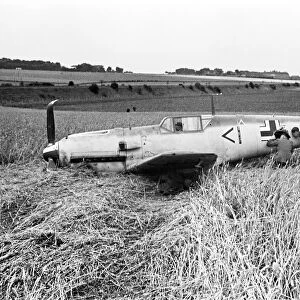 Members of the RAF technical team examine a downed Messerschmitt BF109 during the Battle