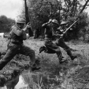 Members of the Reading Home Guard jumping ditches on the blitz course Members of the Reading Home Guard jumping ditches on the blitz course