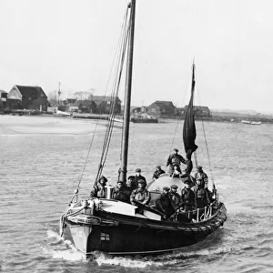 Members of the Southwold, Suffolk lifeboat crew leaving harbour in their boat the Mary