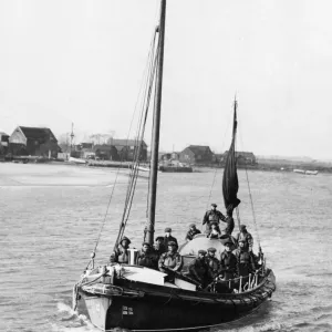 Print of a 1934 photograph: Southwold lifeboat crew departing harbour