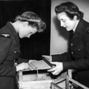 Members of the Womens Auxiliary Air Force being taught the age old craft of
