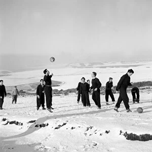 Memebers of Charlton Athletic training in the snow at Eastbourne January 1958