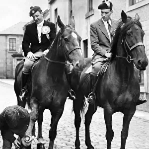 Men in costume riding on horseback during a commemoration of the Battle of Flodden field