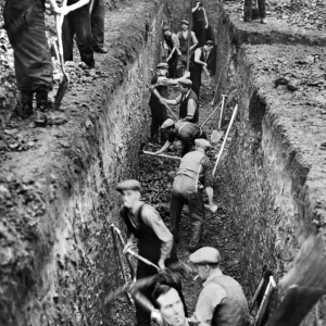 Men digging deep trenches in Birkenhead Park, which will become shelters Men digging deep trenches in Birkenhead Park, which will become shelters