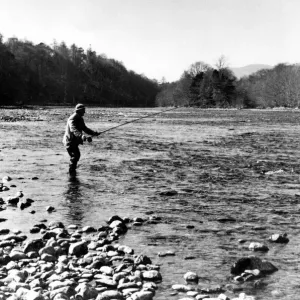 A men enjoys a relaxing day angling 01 / 05 / 79 circa