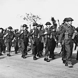 Men of the R. A. F. regiment marching inland to take possession of Maison Blanche aerodrome