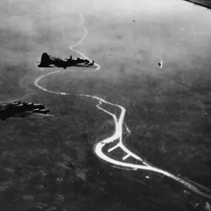 A Messerschmitt 110 goes down in flaming pieces before the massed fire power of A Messerschmitt 110 goes down in flaming pieces before the massed fire power of