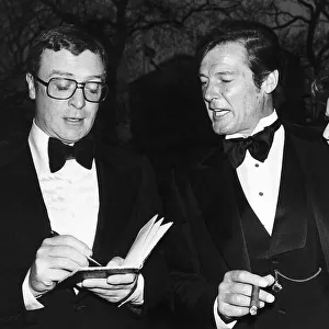 Michael Caine and Roger Moore with third wife Luisa At film premiere Shout at