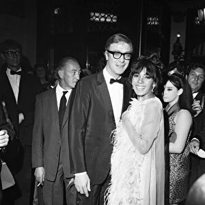 Michael Caine with Shirley Bassey at the premiere of the film Hurry Sundown at the Plaza