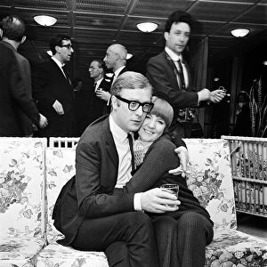 Michael Caine, who stars in the film Alfie poses with Cilla Black