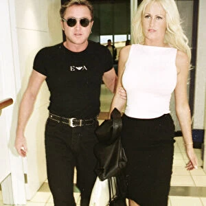 Michael Flatley leaves Heathrow Airport December 1999 with girlfriend Lisa Murphy