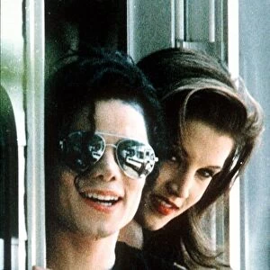 Michael Jackson pop Singer wearing dark glasses With Lisa Marie Presley