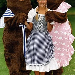 Michalea Strachan Tv Presenter Standing with two life size teddy bears