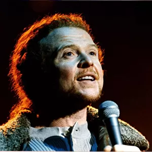 Mick Hucknall pop singer with Simply Red performing on stage