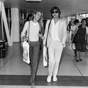 Mick Jagger and girlfriend, model, Jerry Hall, pictured at London Heathrow Airport Mick Jagger and girlfriend, model, Jerry Hall, pictured at London Heathrow Airport