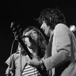 Mick Jagger and guitasrist Bill Wyman performing on stage during a Rolling Stones concert Mick Jagger and guitasrist Bill Wyman performing on stage during a Rolling Stones concert