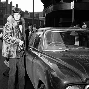 Mick Jagger of The Rolling Stones about to get into his car after filming ITVs