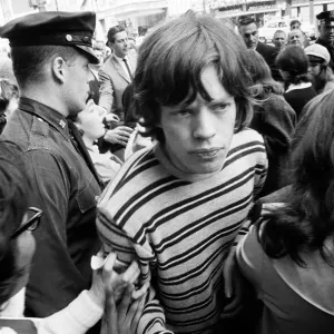 Mick Jagger of The Rolling Stones surrounded by fans on Broadway. 2nd June 1964 Mick Jagger of The Rolling Stones surrounded by fans on Broadway. 2nd June 1964