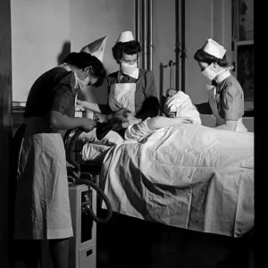 Midwives deliver a new born baby inside thew Labour ward at the British Hospital for