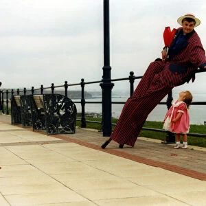 Mike Bridge on stilts with chloe Gardener, 2, helps relaunch historic Seaham promenade