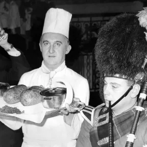 Mike Harper piping in the haggis perepared by the chef, Mr