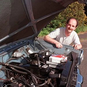 MIKE OROBCZUK WITH HIS VAUXHALL CRESTA LOOKING AT ENGINE
