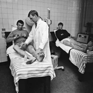 Mike Summerbee (left) being examined Manchester City players Colin Bell Mike Summerbee (left) being examined Manchester City players Colin Bell