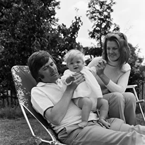Mike Yarwood relaxing at home with his wife Sandra and their 10-month-old daughter