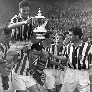 Millard, the West Brom Captain holding the FA Cup is chaired by his colleagues round