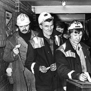 Miners at Boldon Colliery place their ballot papers in the ballot box as they vote