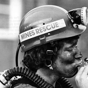 A Mines rescue worker kissing his canary. January 1981 P017743