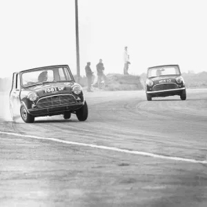 Two Mini Coopers seen here competing in the Daily Mirror Trophy event at Snetterton 29th Two Mini Coopers seen here competing in the Daily Mirror Trophy event at Snetterton 29th