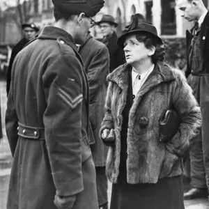 Miss Ellen Wilkinson sympathising with Corporal LG Biddle, whose twins, aged 5 Miss Ellen Wilkinson sympathising with Corporal LG Biddle, whose twins, aged 5