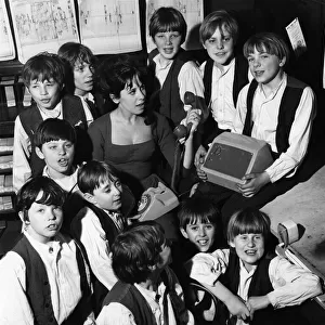Miss Marti Webb, surrounded by Fagins gang from the cast of Oliver