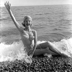 Model Angela Williamson on the beach. June 1960 M4326-001