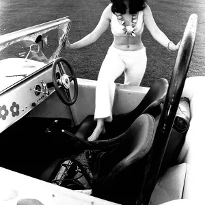 A model in a beach buggy wearing a blouse and trousers in April 1970 A model in a beach buggy wearing a blouse and trousers in April 1970