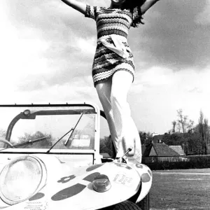 A model in a beach buggy wearing a dress in April 1970 A model in a beach buggy wearing a dress in April 1970