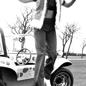 A model in a beach buggy wearing trousers and a fur gillet in April 1970 A model in a beach buggy wearing trousers and a fur gillet in April 1970