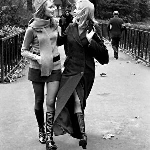 Model Blanche Webb wearing mini skirt and knee high boots with model Monica Hahn wearing