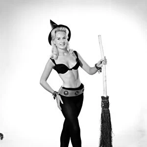 Model Brenda Bartlet dressed as a witch. October 1959