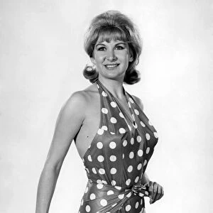 Model Caron Gardner wearing a polka dot patterned swimsuit