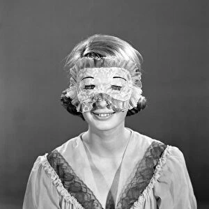 Model Dawn Chapman wearing face mask to aid her in getting a good nights sleep. 1962