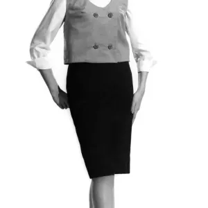 Model Diana Lovell wearing shirt bow tie and waistcoat with knee length skirt Model Diana Lovell wearing shirt bow tie and waistcoat with knee length skirt