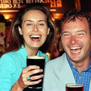MODEL EILEEN CATTERSON AND TV PRESENTER JOHN LESLIE HAVING SOME FUN AT THE LAUNCH OF