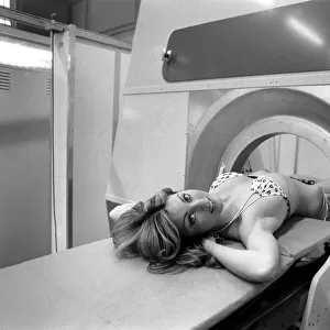 Model Gillian Duxbury in E. M. I. X-Ray scanner. April 1975 75-1905-007