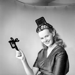 Model Hilda Moray wearing unusual Easter bonnet. March 1953