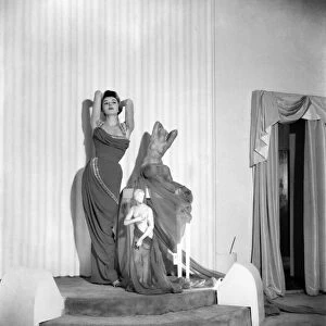 Model June Sweetzer poses wearing an elegant long dress. September 1952 C4772