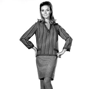 Model Maureen Walker wearing a striped long sleeved top and skirt. November 1968