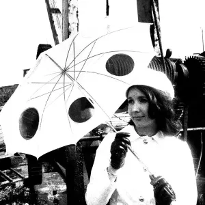 A model posing with and unbrella in April 1970 A model posing with and unbrella in April 1970