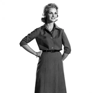 Model Roma Reeves wearing long dress, standing with hands on hips. October 1961 P008783